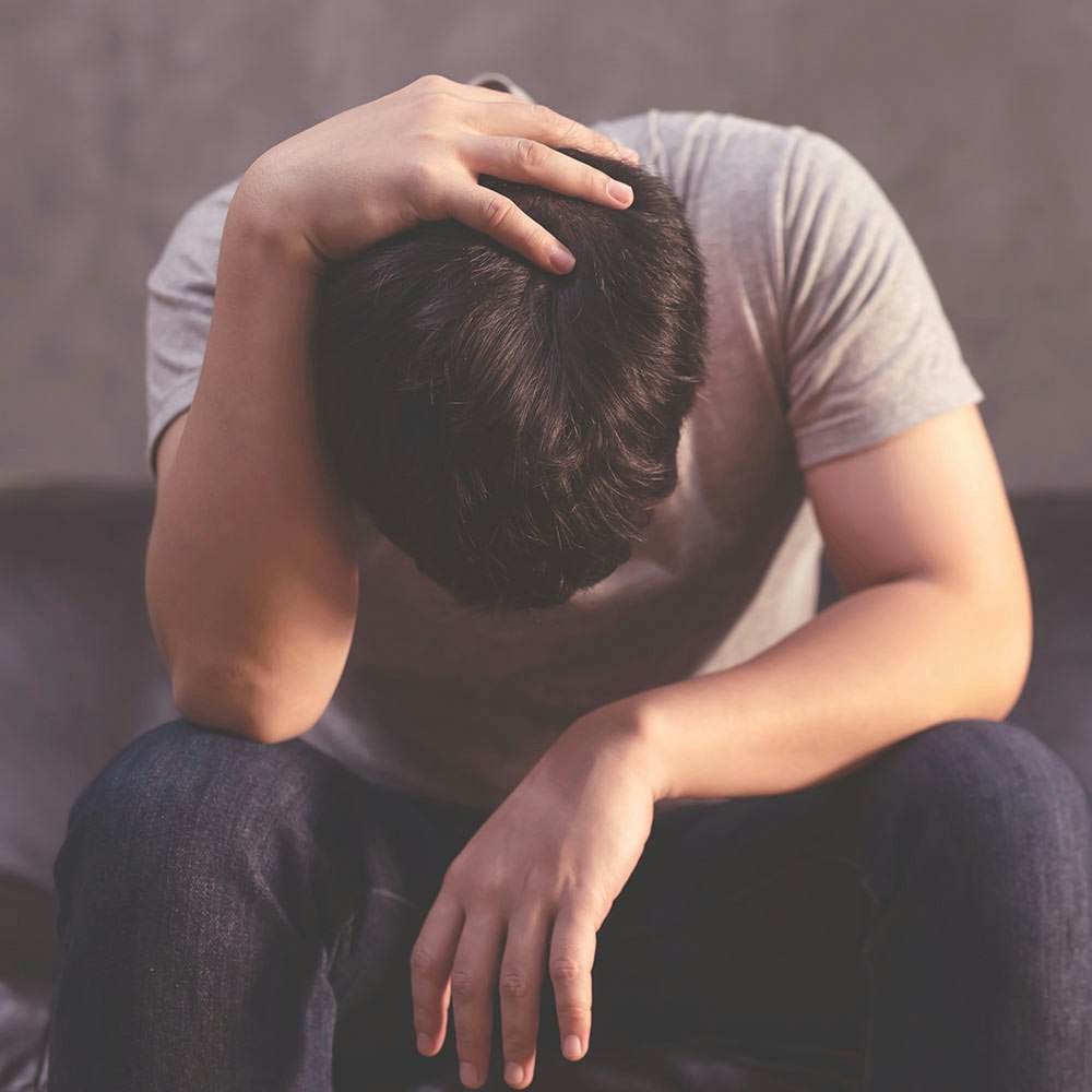 Frustrated man with hand on head