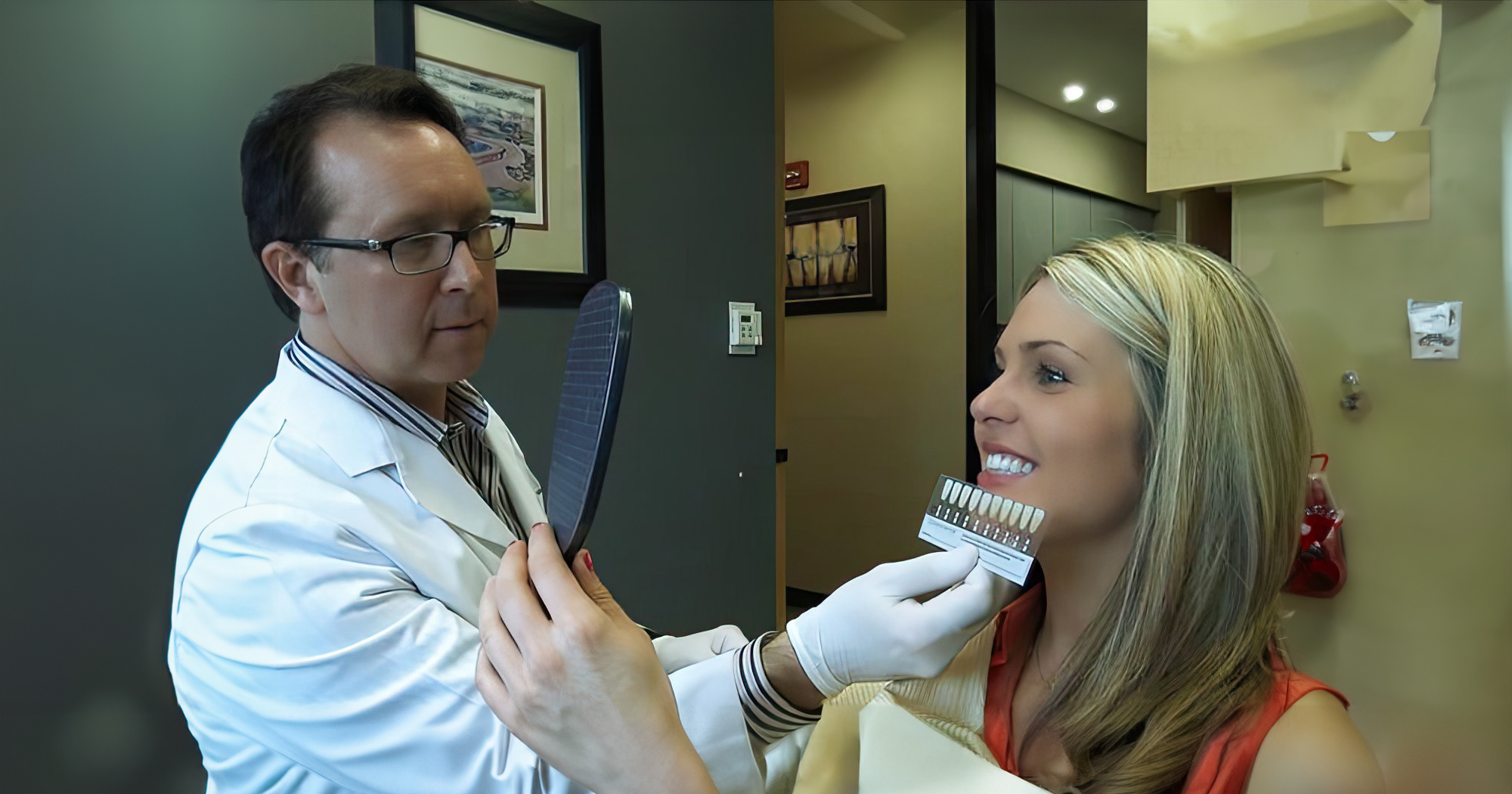 dr. Goodman shadematching a patient for veneers