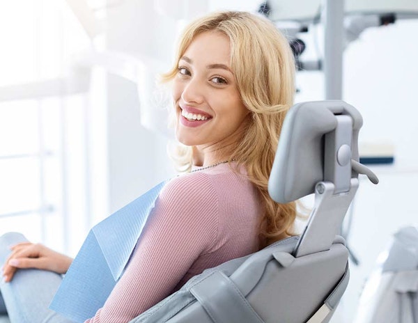 Smiling woman at the dentist