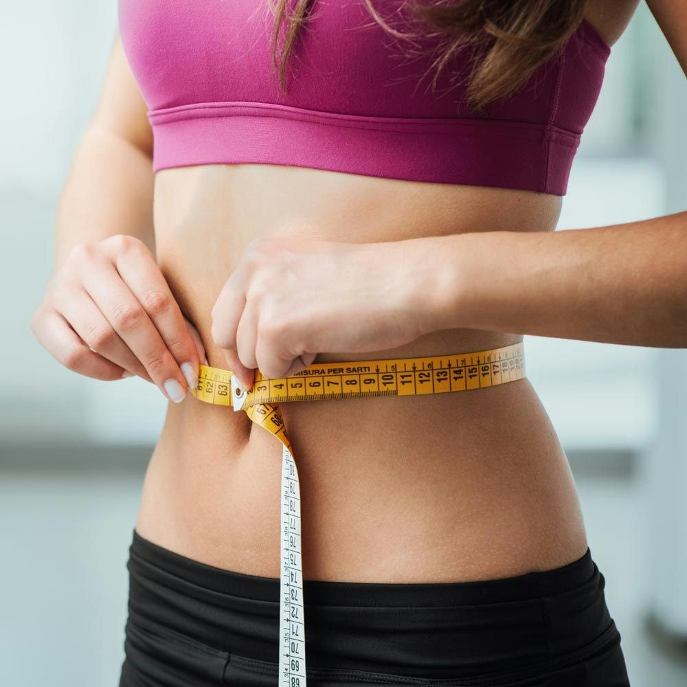 Woman measuring waist