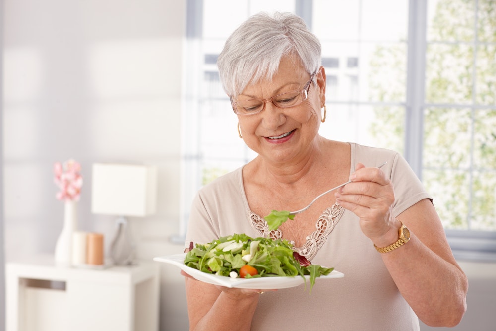 woman eating salad