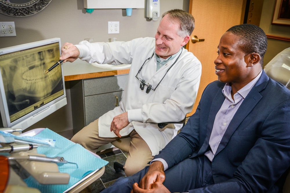 Dr. Fuqua looking at scans