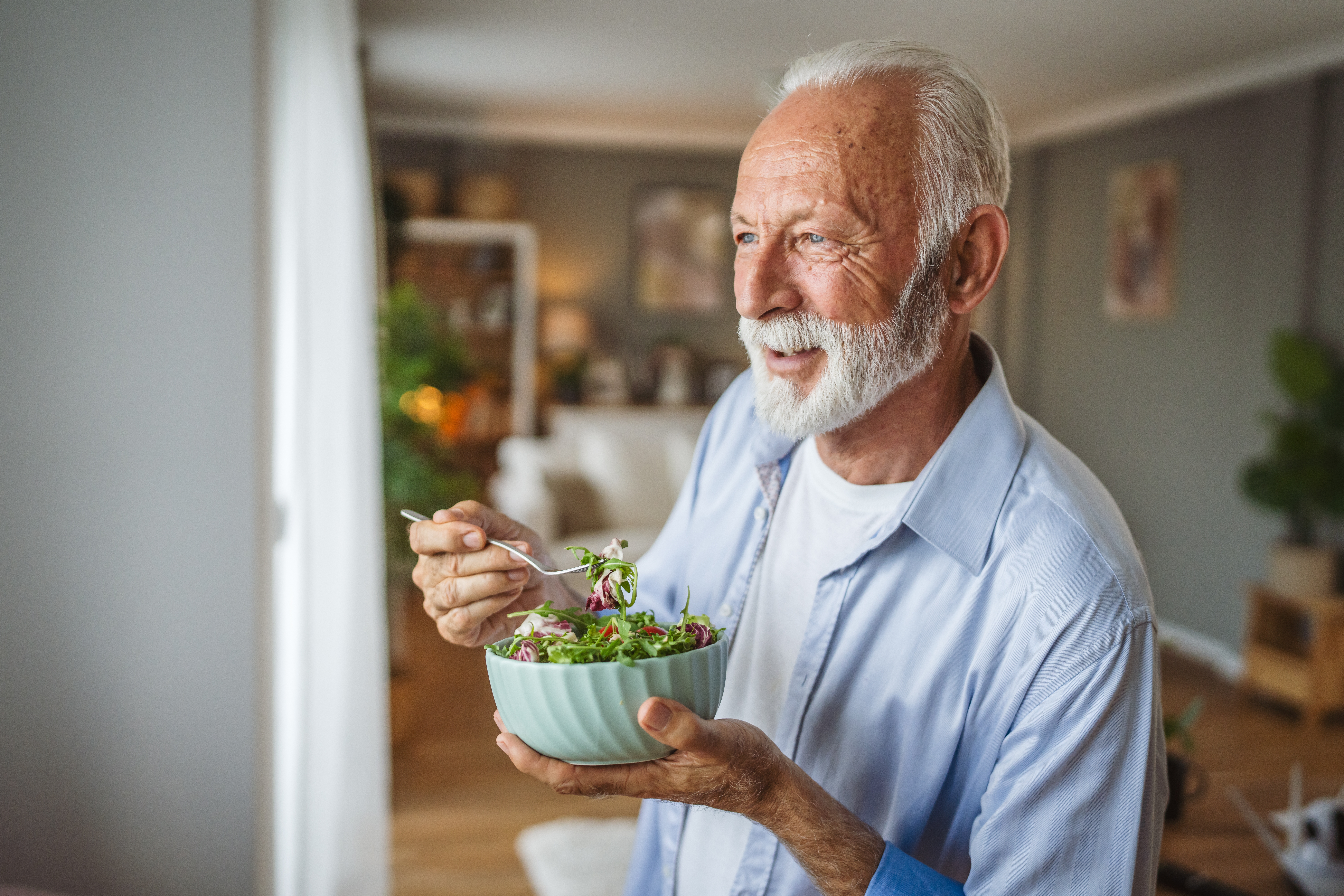 Senior man eating a salad