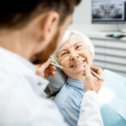 elderly woman at dental appointment