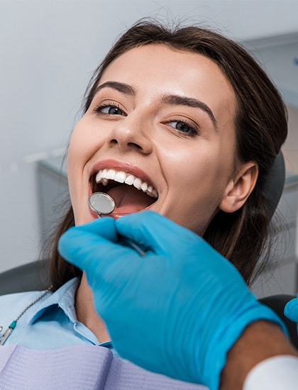 Dr. Mortensen conducting a dental exam