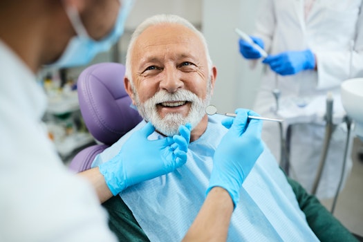 a mature man visiting his dentist