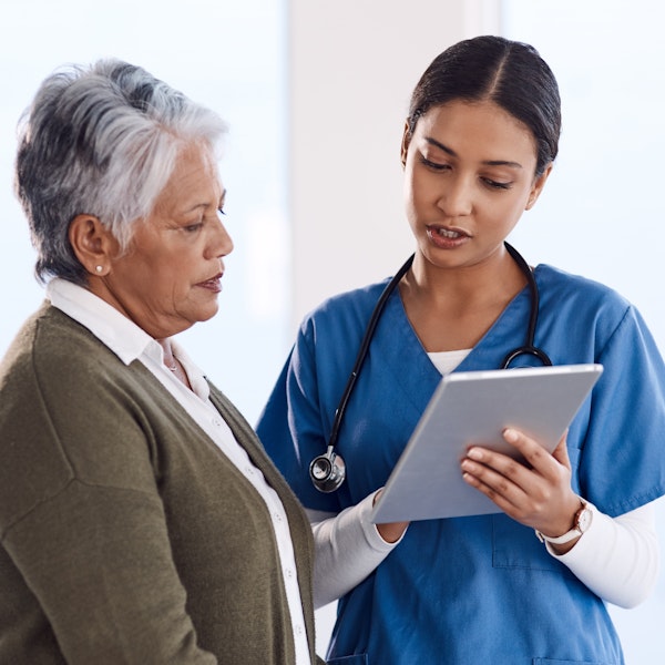 Doctor reviewing chart with patient