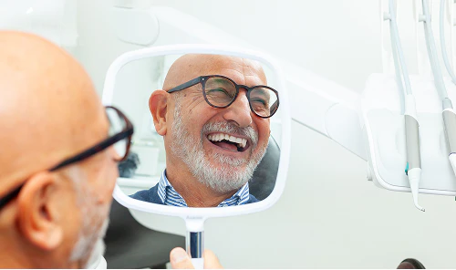 Man smiling in mirror