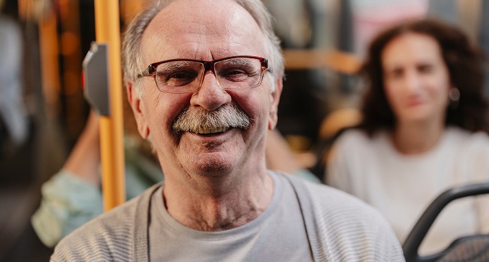 Man with glasses smiling