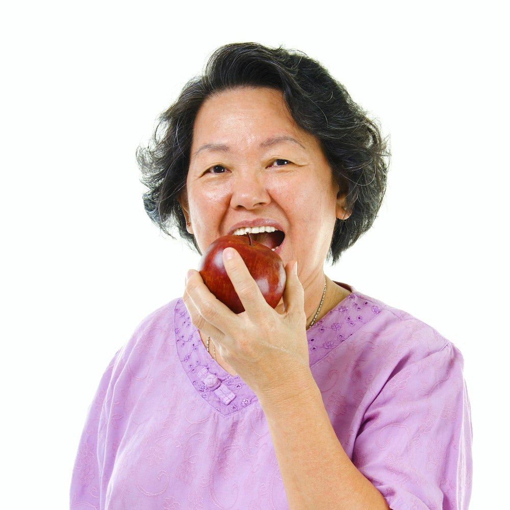 Woman eating an apple