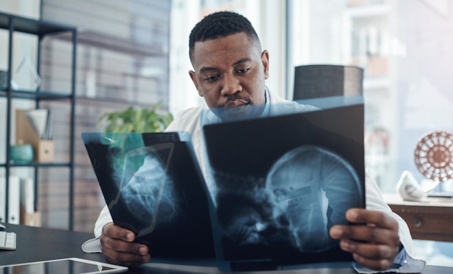 Doctor looking at X-rays
