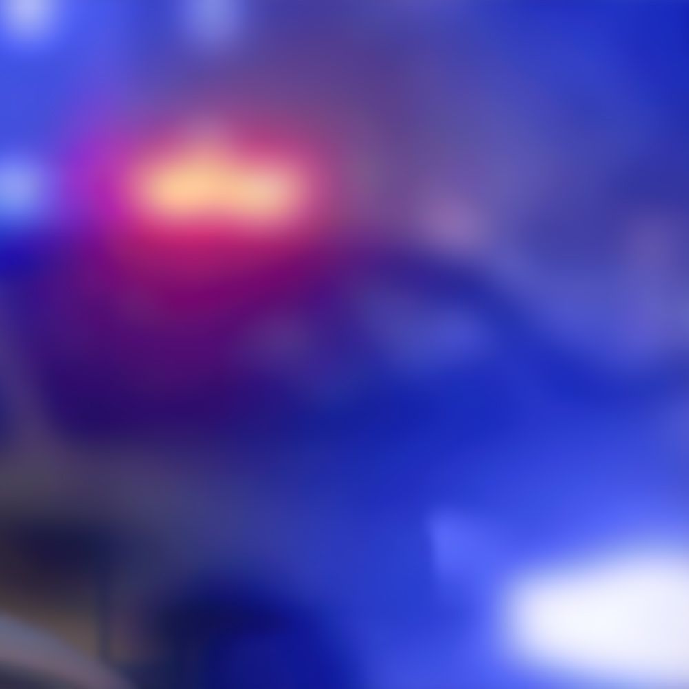 Blurred crime scene with cop cars and lights