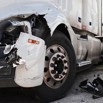Big rig with a damaged bumper