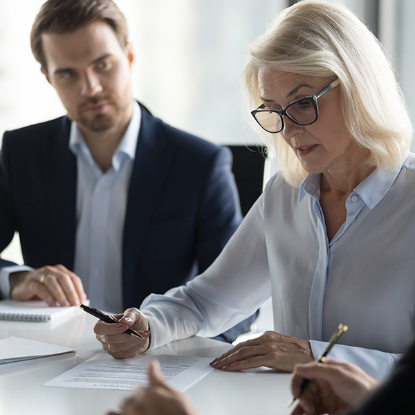 Lawyer and client completing paperwork