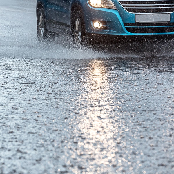 a car driving in the rain