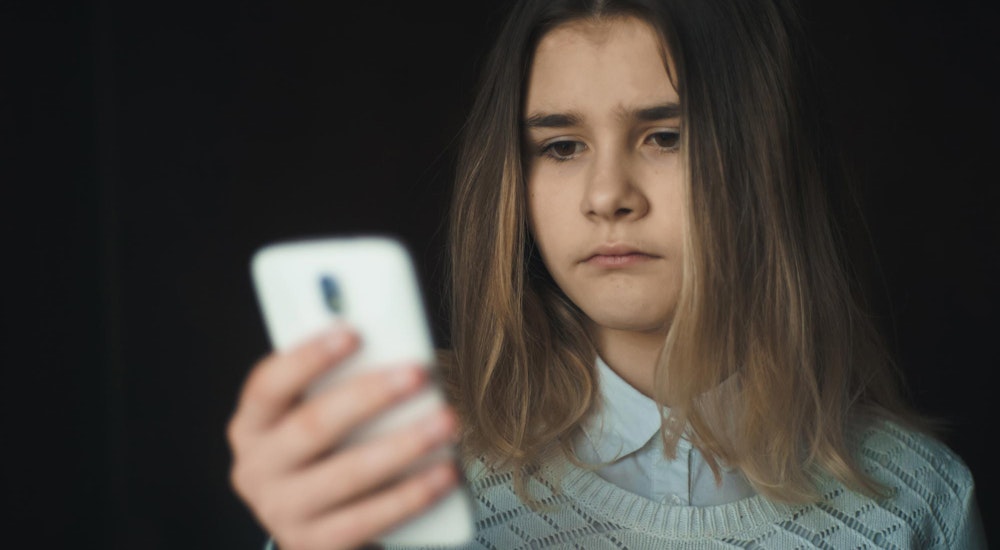 Abused foster child getting ready to make a phone call