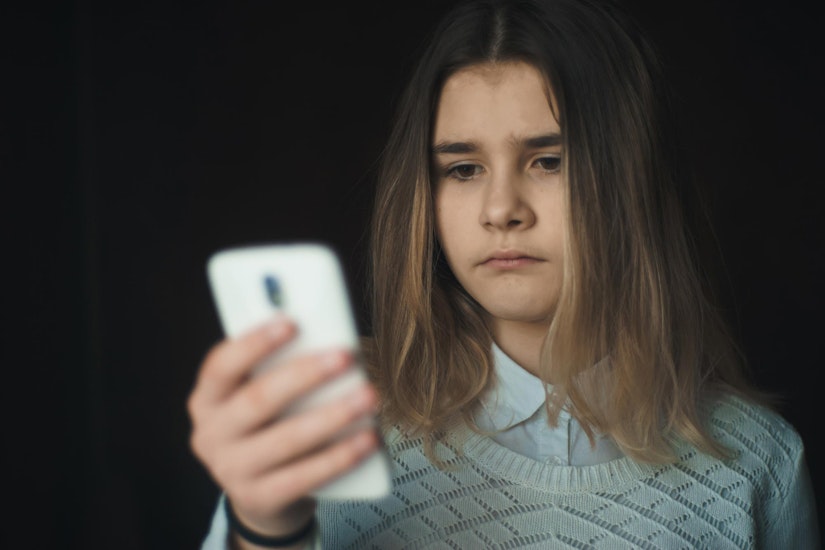 Abused foster child getting ready to make a phone call