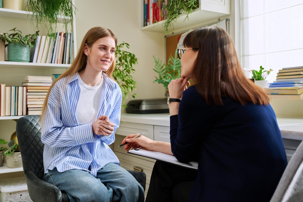 Young woman talking to a counselor