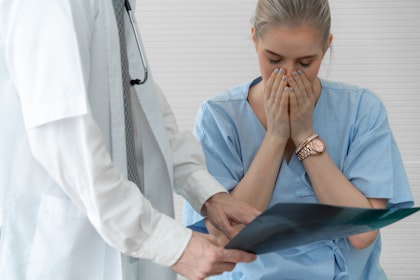 Member of medical staff is upset when being shown the mistake they made