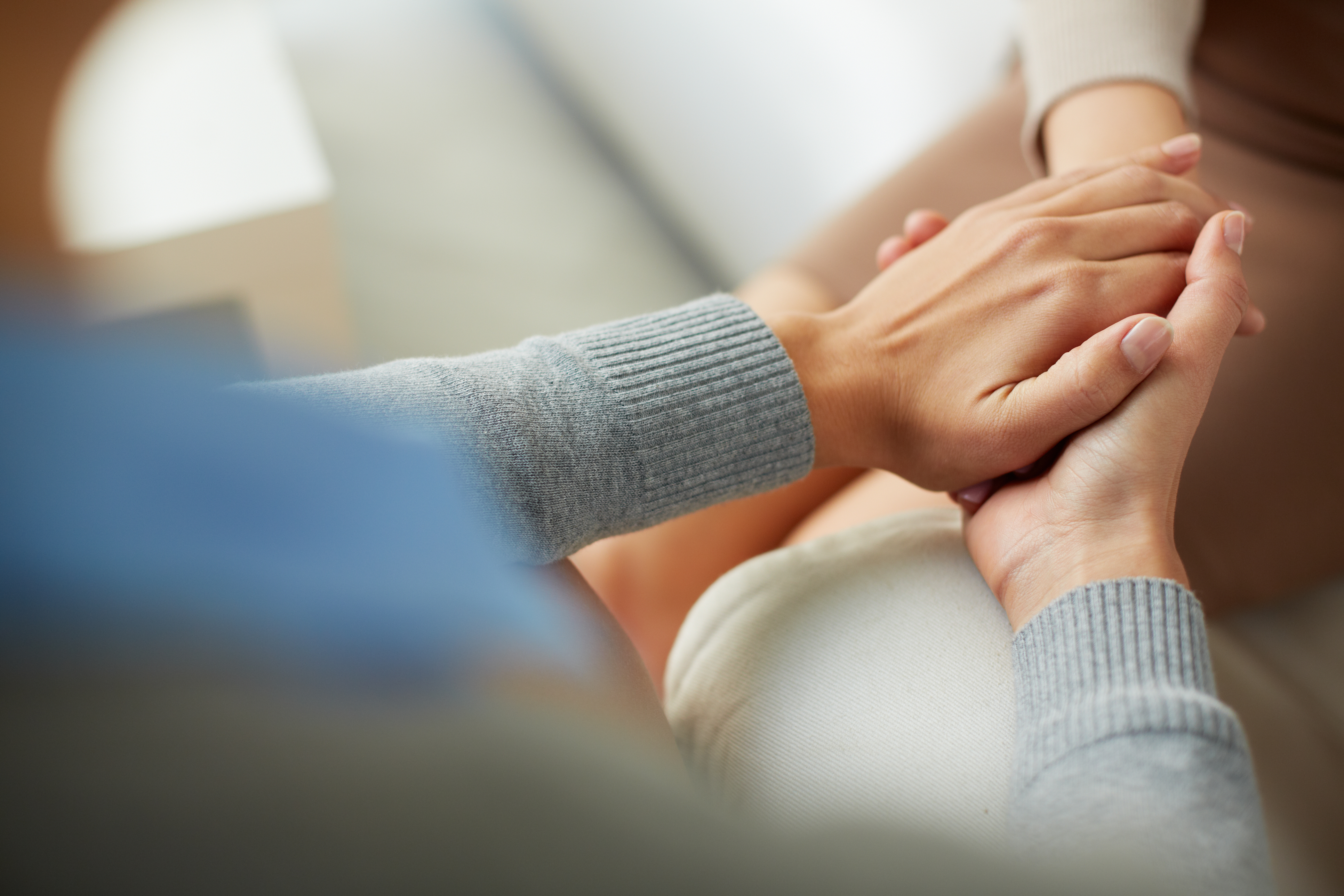 Woman holding someone's hand