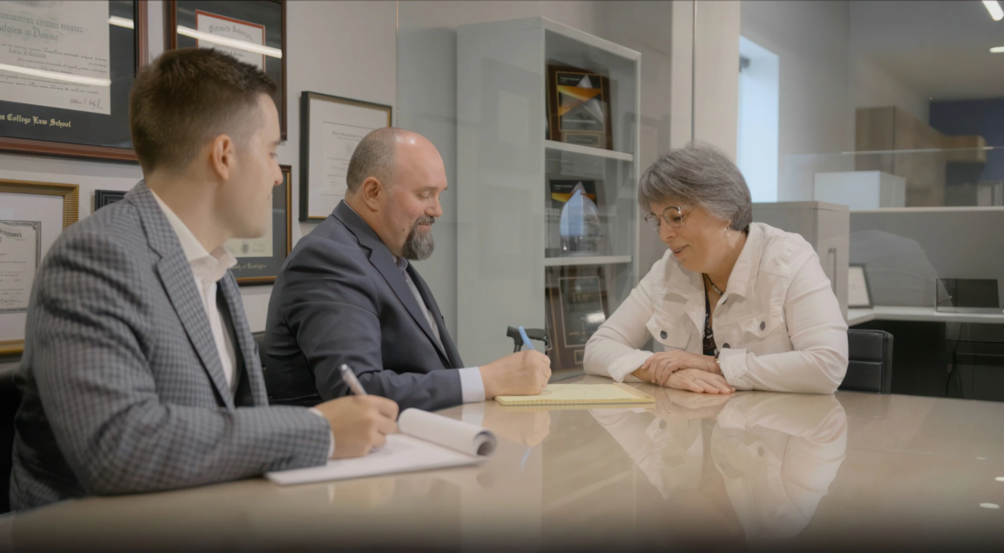 Cole Douglas and Loren Cochran interviewing a client in their Olympia Washington office