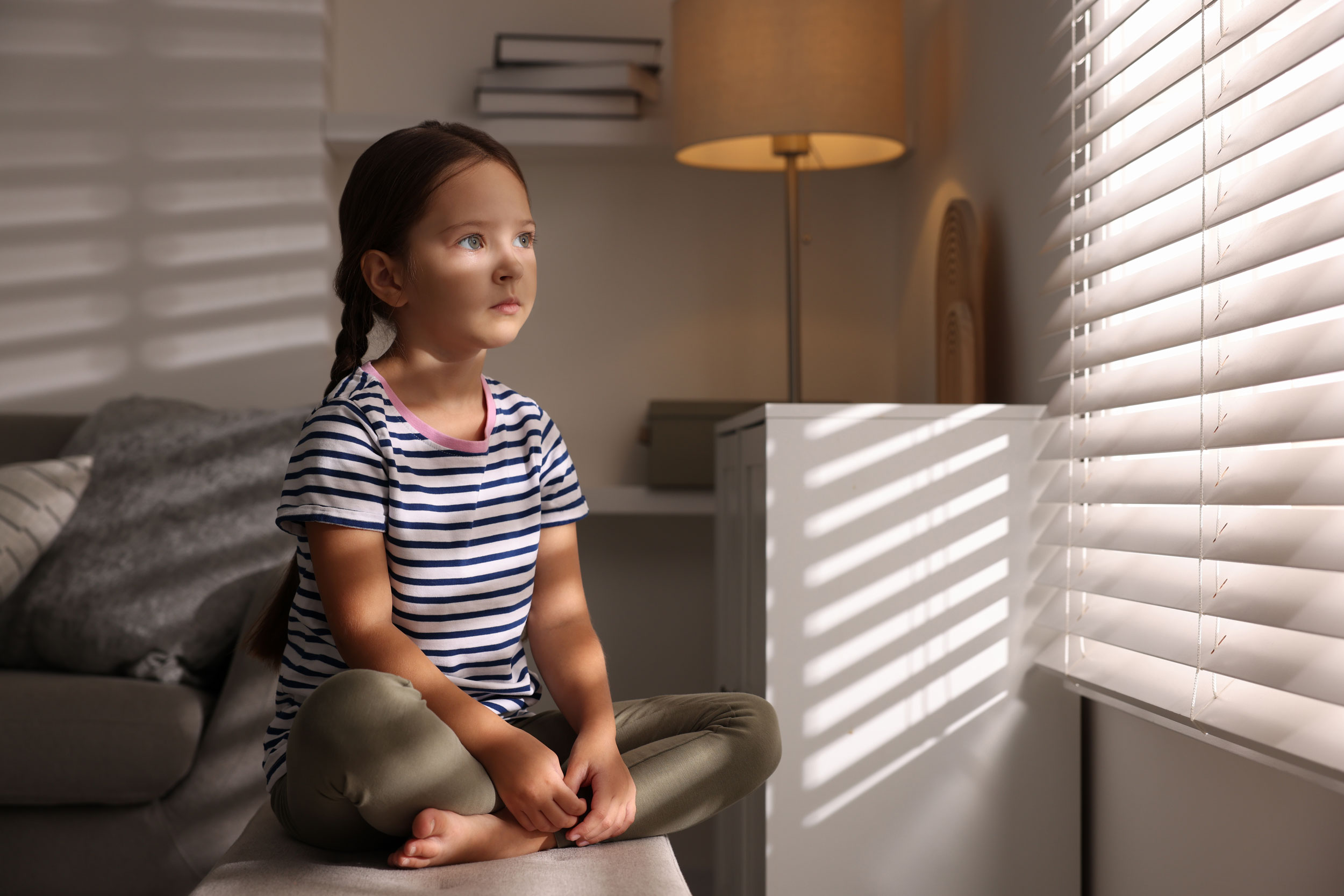 child looking out the window in Puyallup, Washington