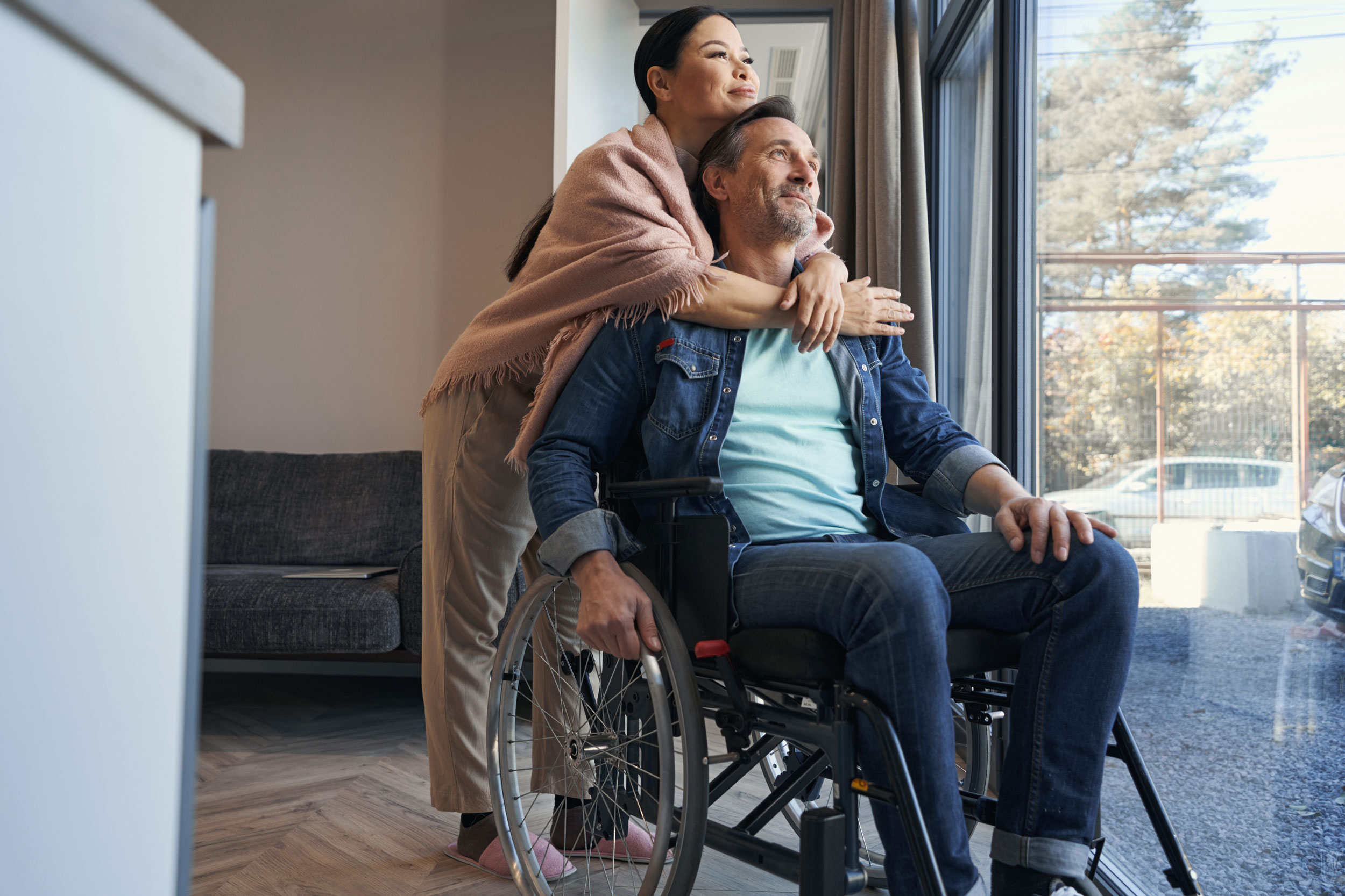 woman hugs man in wheelchair in Puyallup Washington