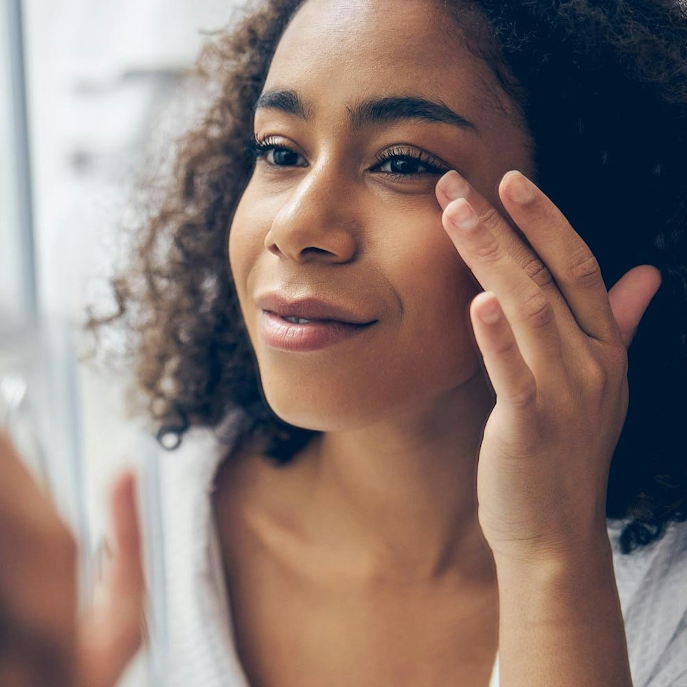 Woman looking in mirror