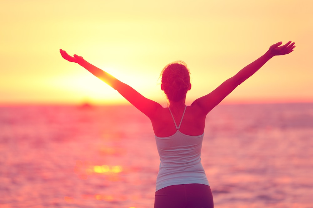 Woman at beach at sunset