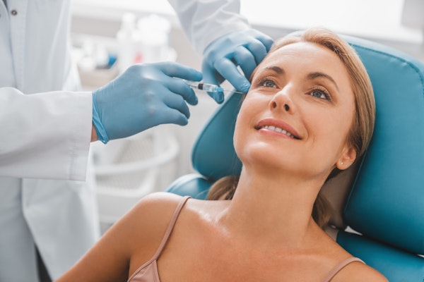 female patient receiving injectable treatment with Dr. Cohen