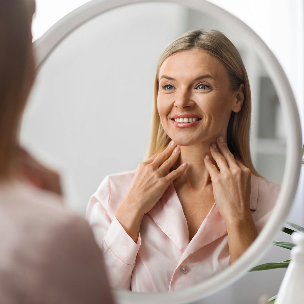 woman looking in the mirror