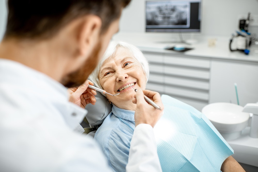 Older woman getting teeth examined