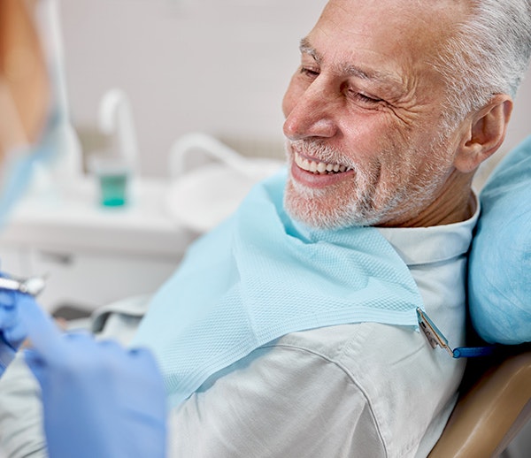 Man smiling in dental chair