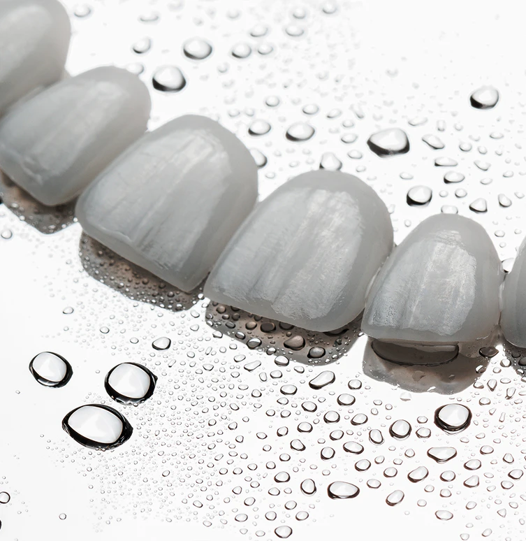 close up of veneers on a wet table