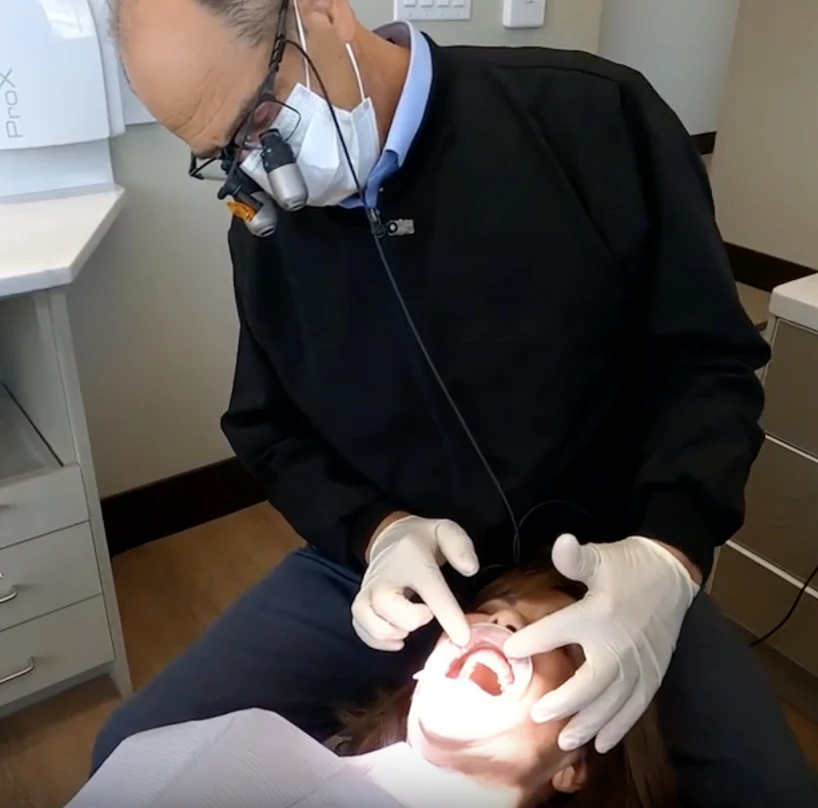 Dr. Slaman working on a patient