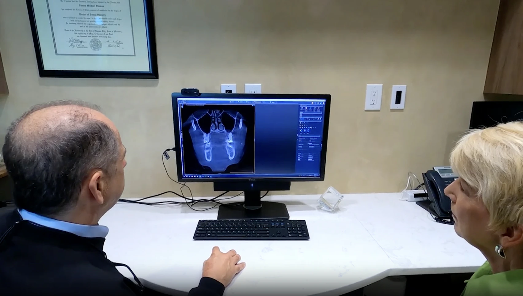 Dr. Slaman and patient reviewing xray photos