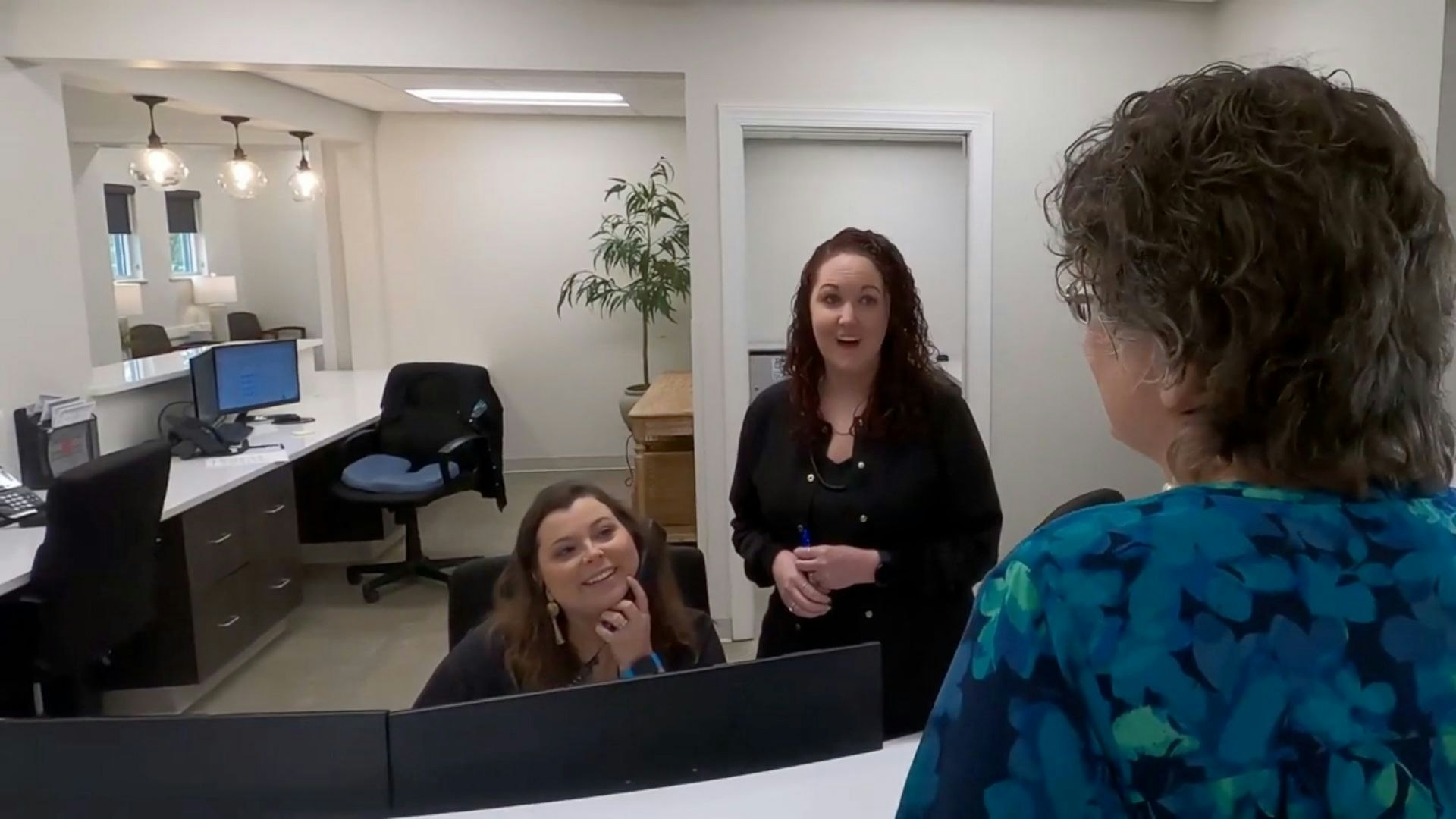 Staff behind desk
