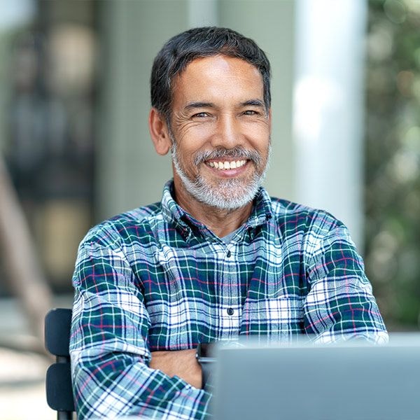 Smiling man at computer