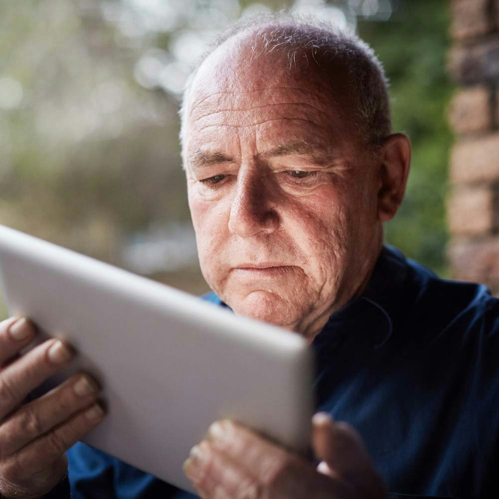 elderly man looking at something