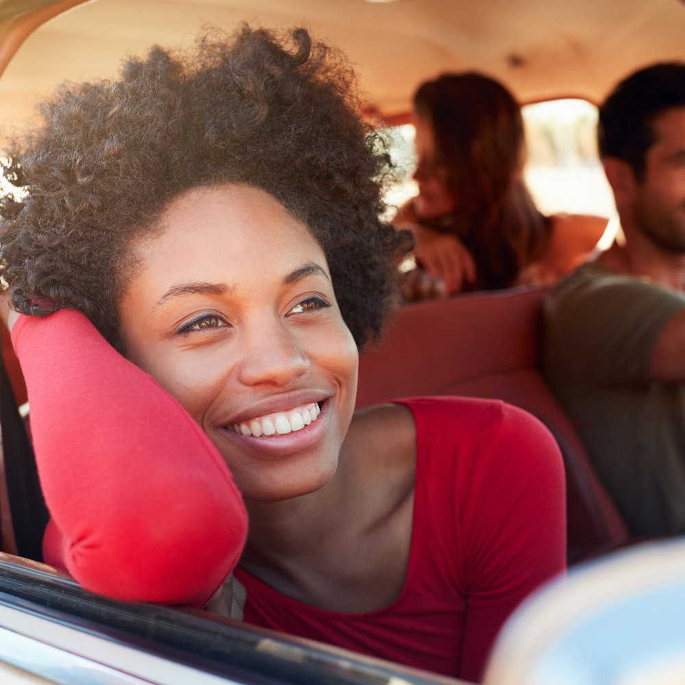 Laughing couple driving in car