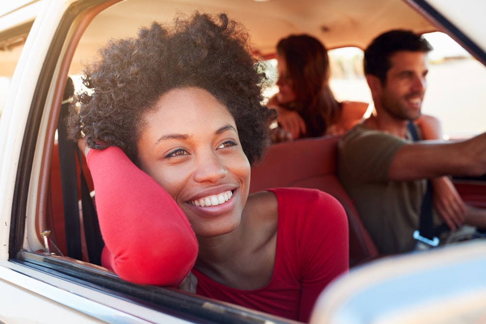 Laughing couple driving in car
