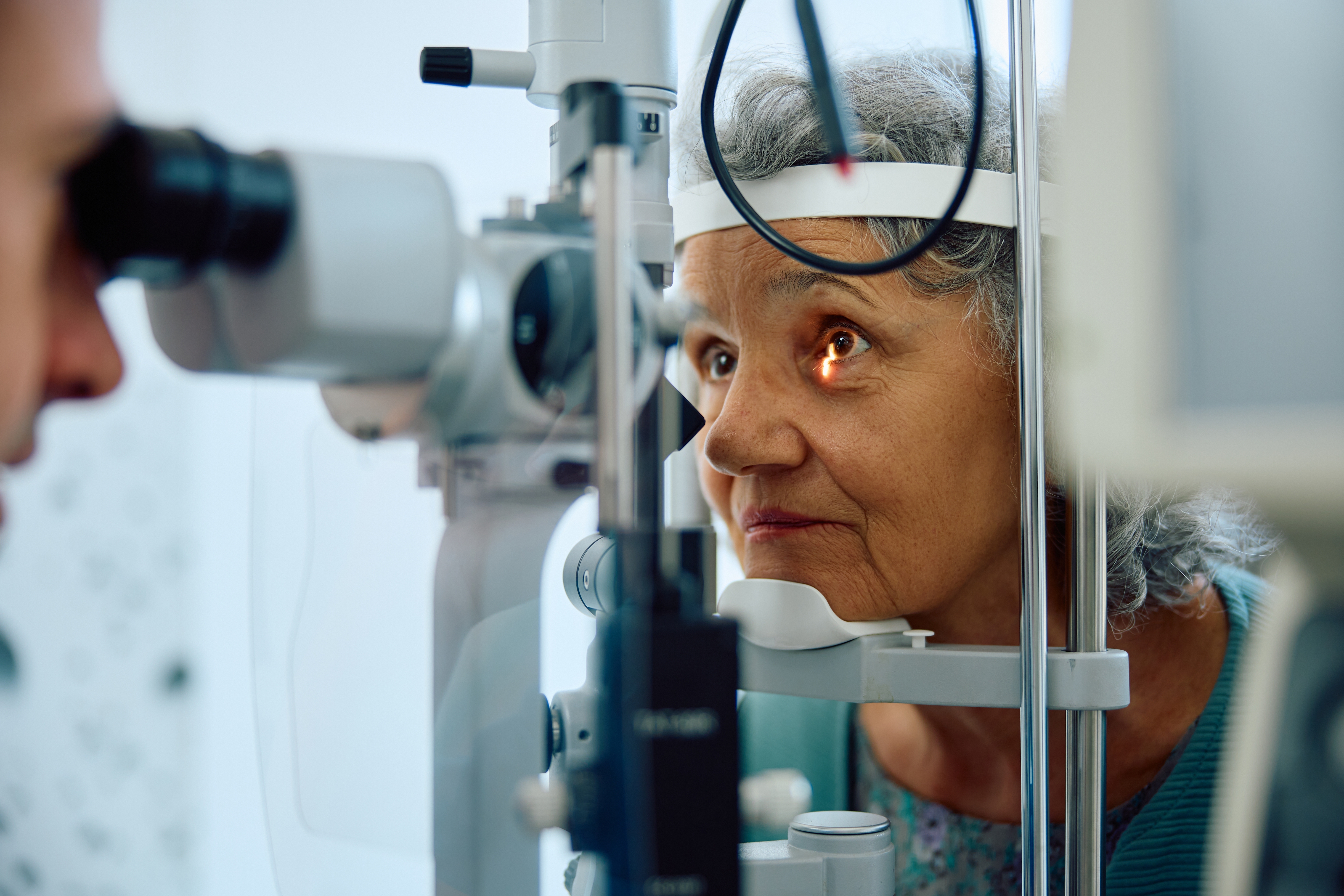 Senior woman getting her eyes examined
