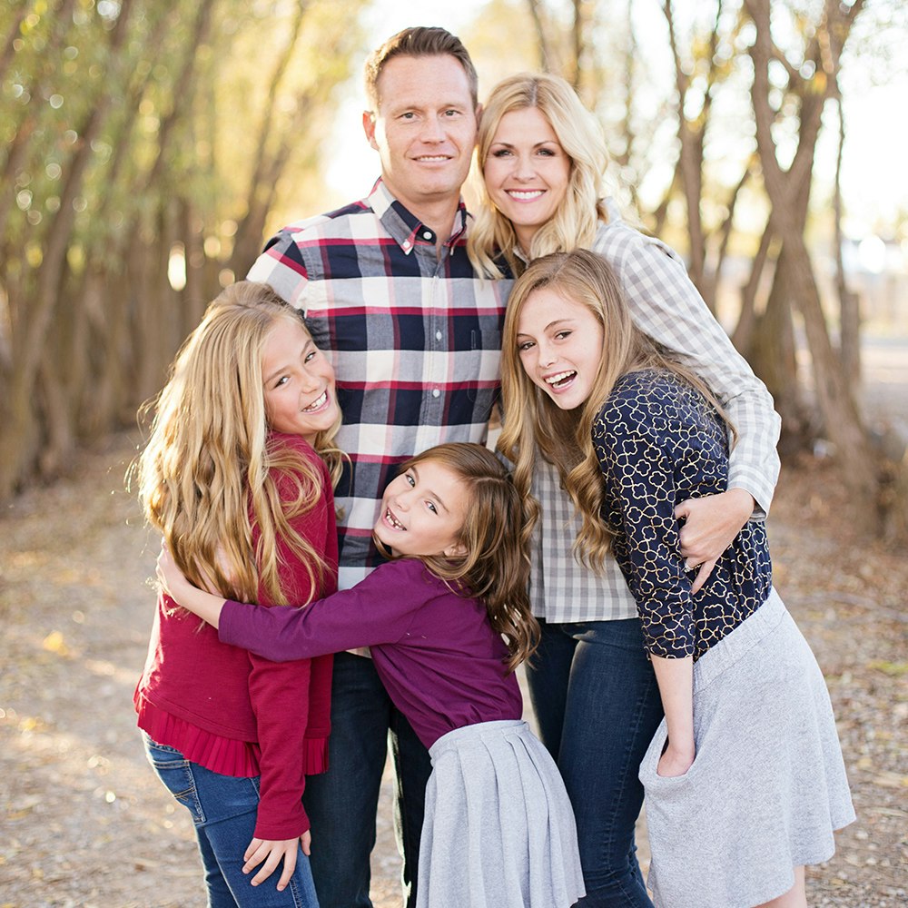 a family posing outdoors