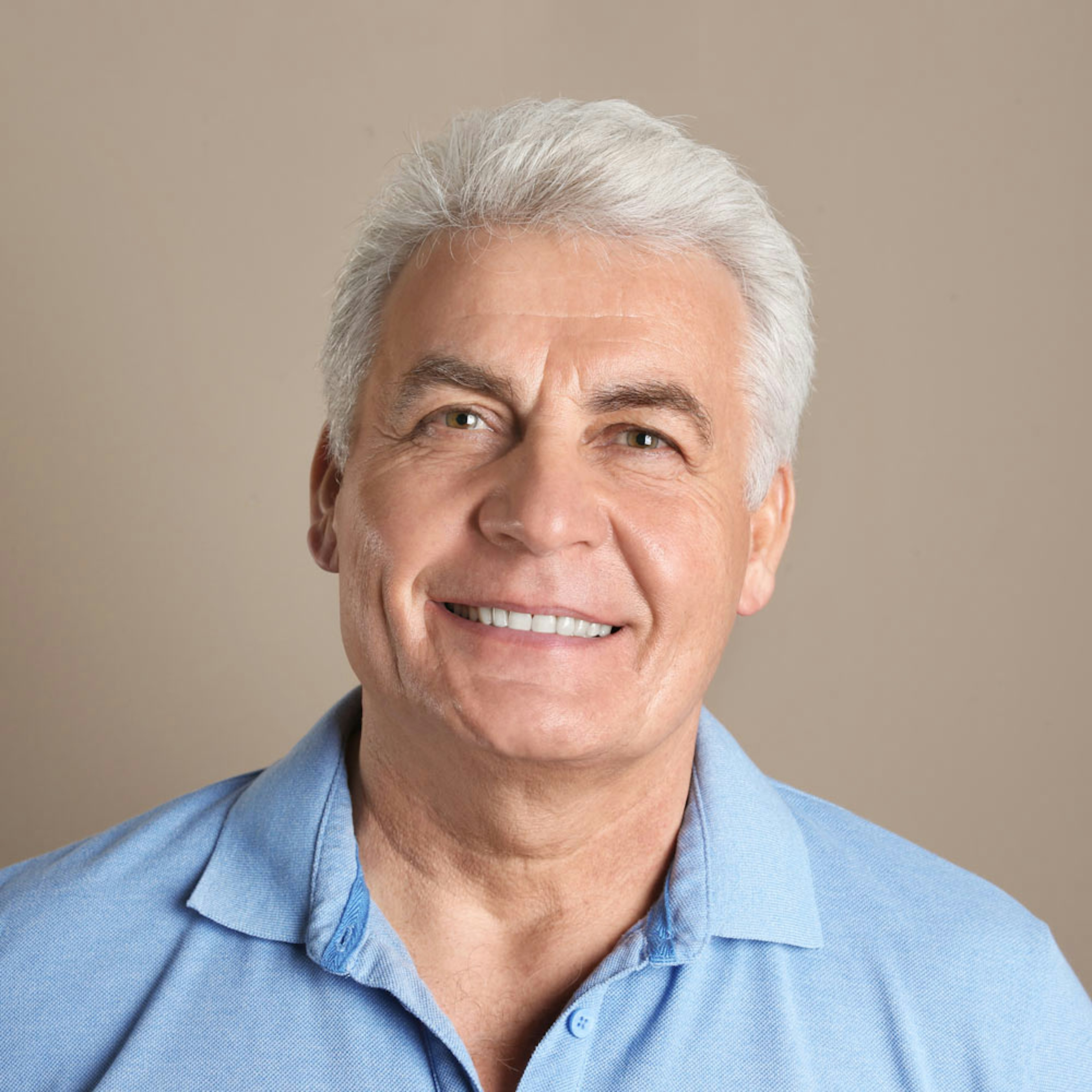 Smiling mature man after full mouth reconstruction