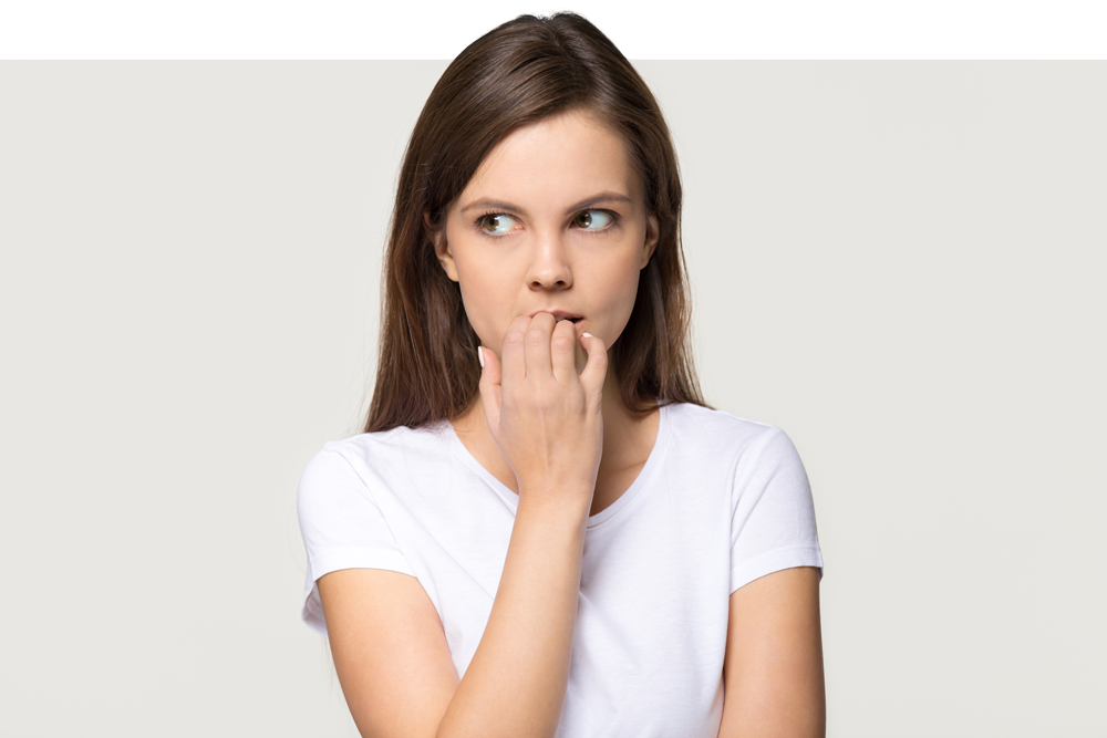 Apprehensive woman considering sedation for her wisdom tooth removal