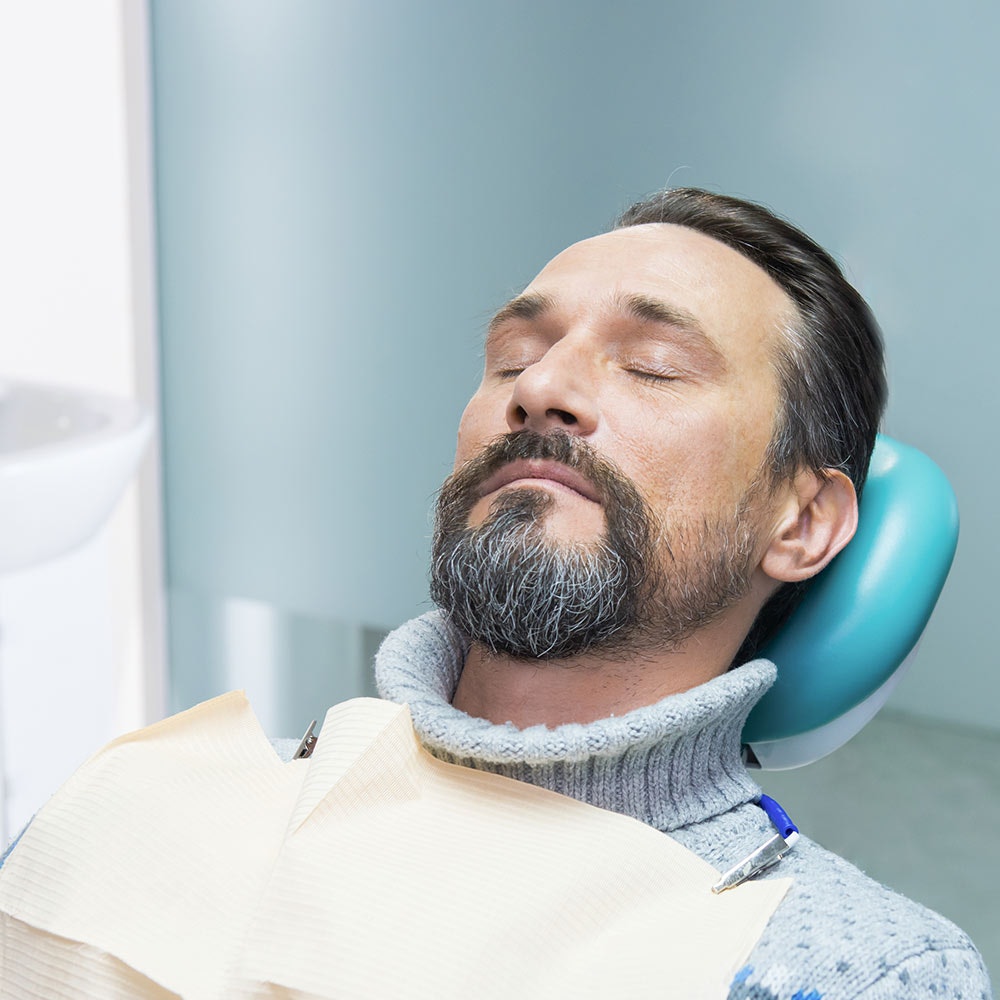 Man under dental sedation