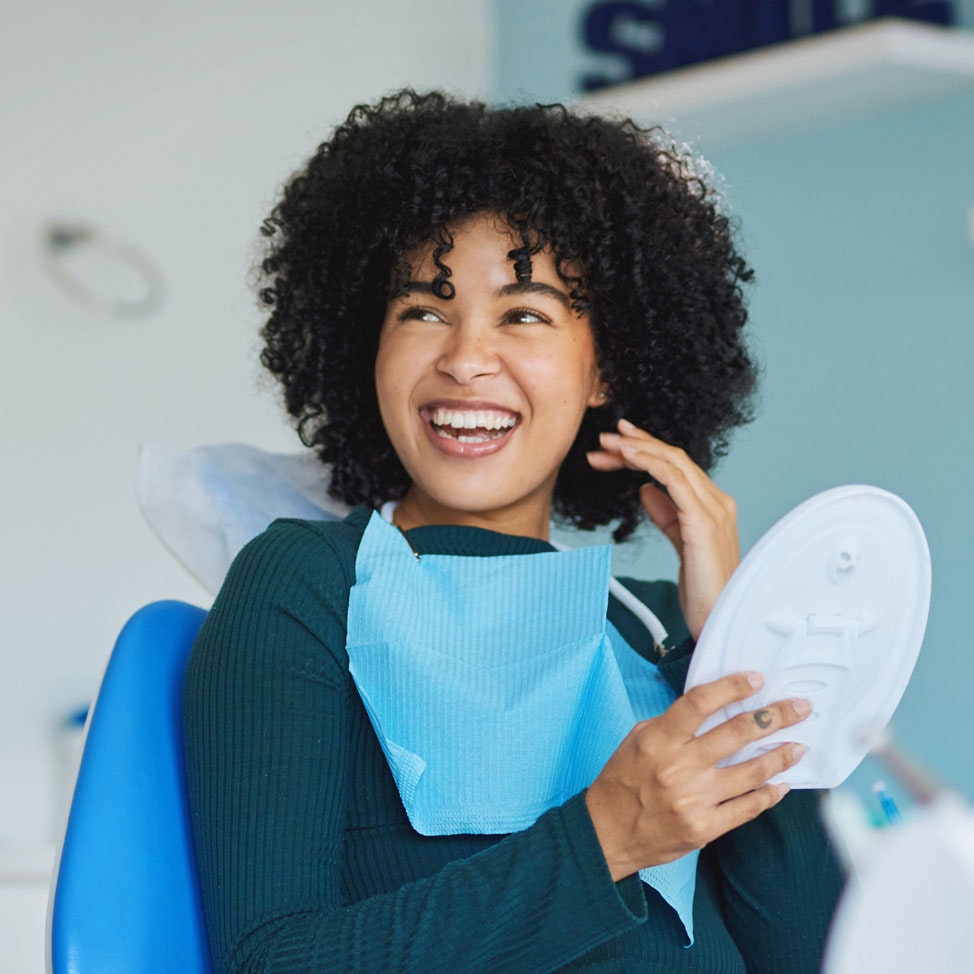 Smiling woman in dental chair