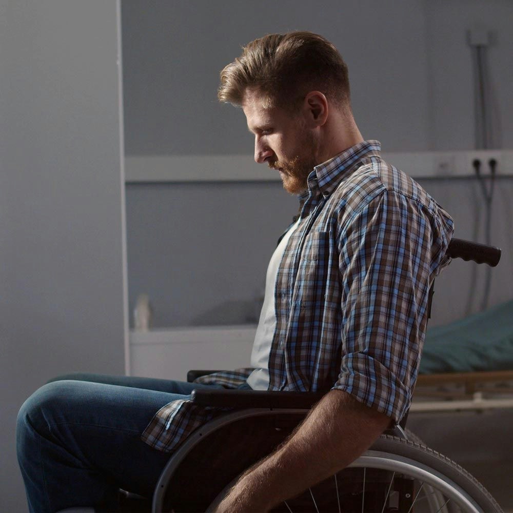 Young man in a wheelchair at the hospital