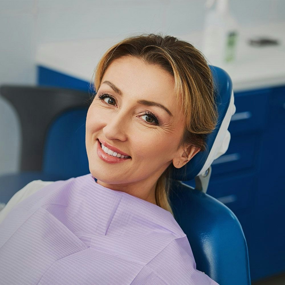 Smiling woman in dental chair