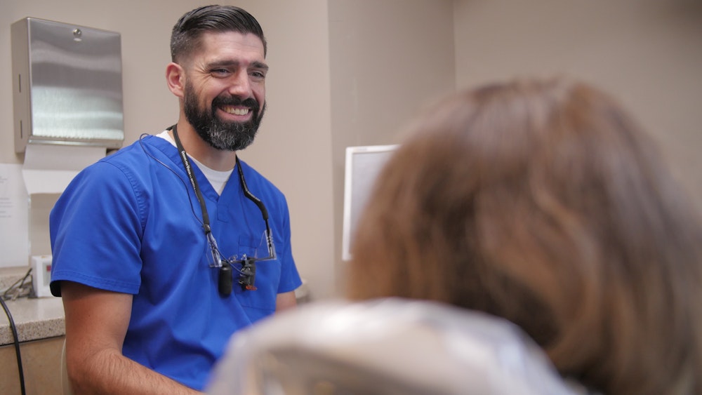 dentist smiling at a patient